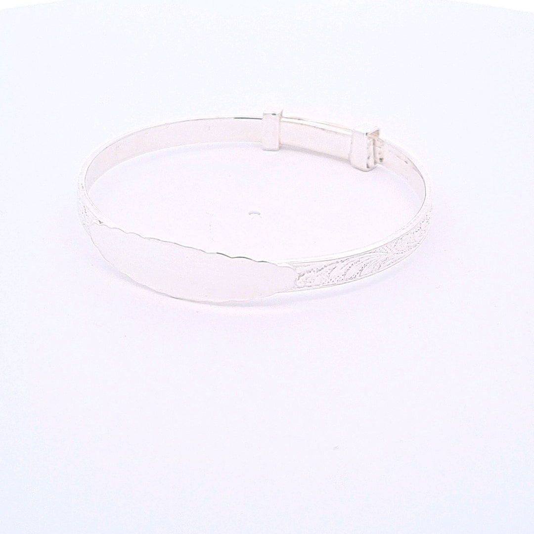 Sterling silver expanding engraved pattern ID Christening bangle 33706 - Armin Lowe Jewellers